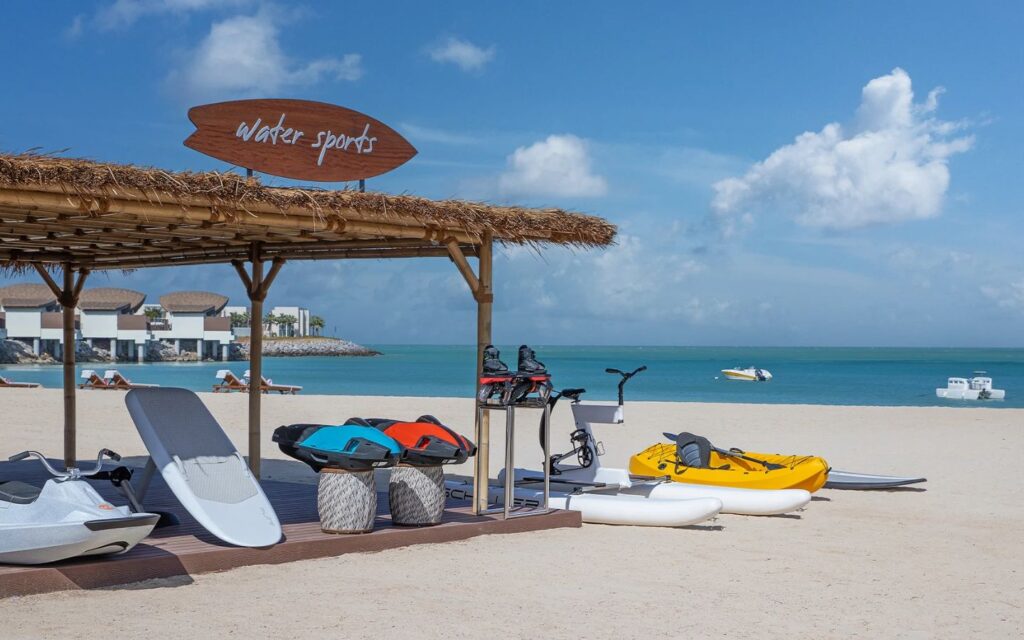 Guests enjoying watersports at Anantara Mina Al Arab resort