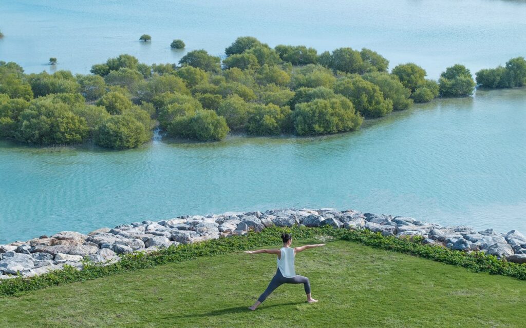 Outdoor yoga by the mangroves at Anantara Mina Al Arab