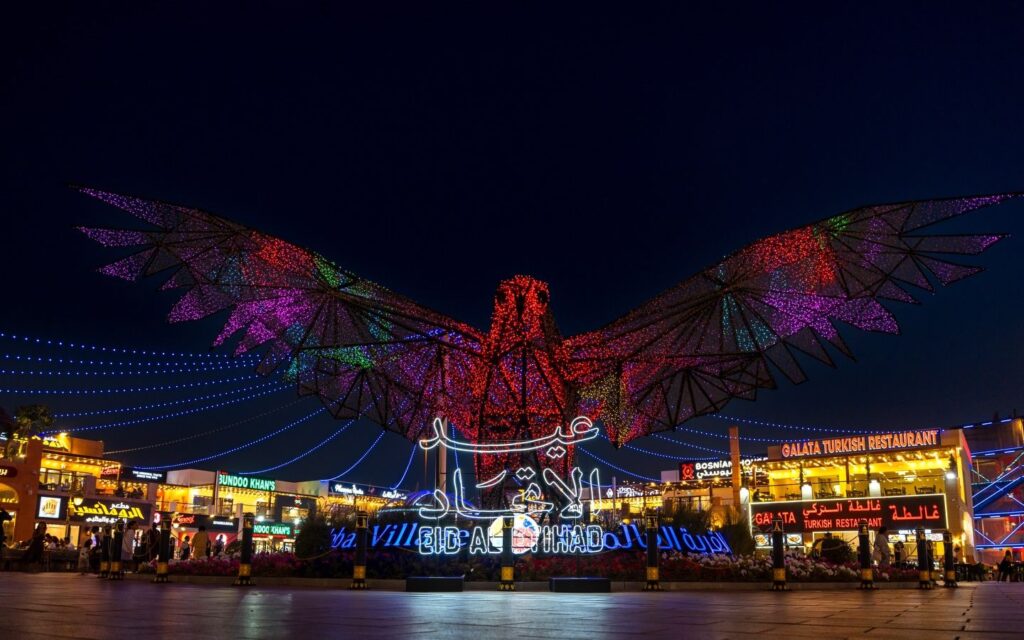Global Village winter attractions in Dubai with pavilions and lights