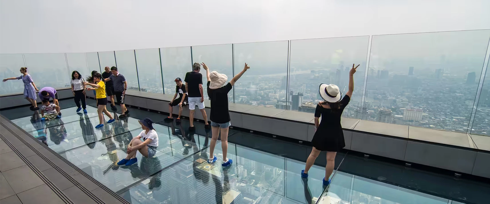 MahaNakhon SkyWalk glass floor and Bangkok skyline
