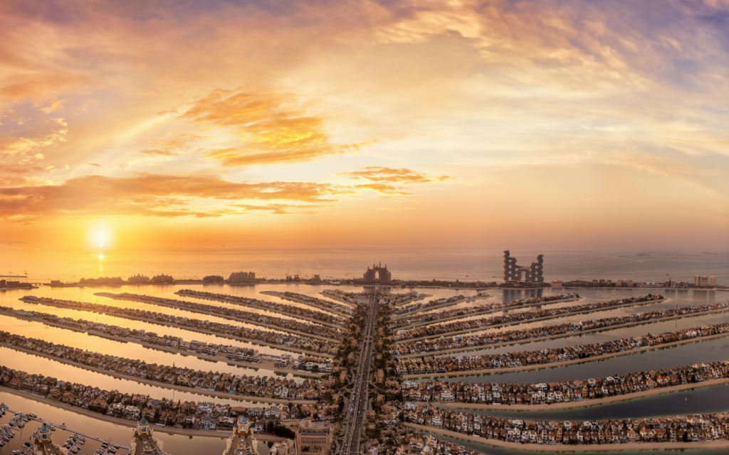 Sunrise over Palm Jumeirah and Dubai skyline from The View at The Palm observation deck