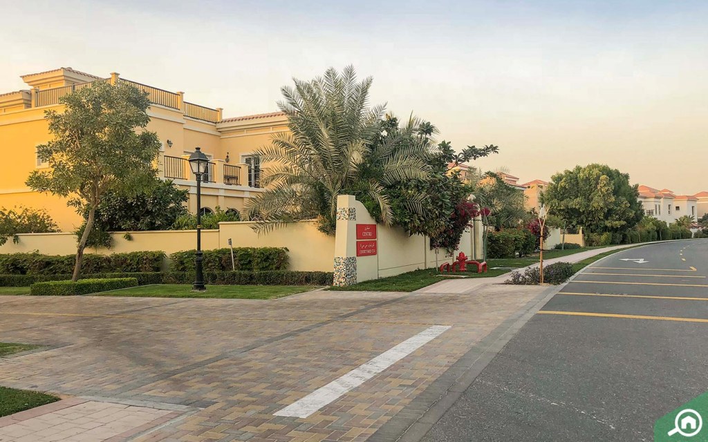 aerial view of Dubailand with villa neighborhoods and parks