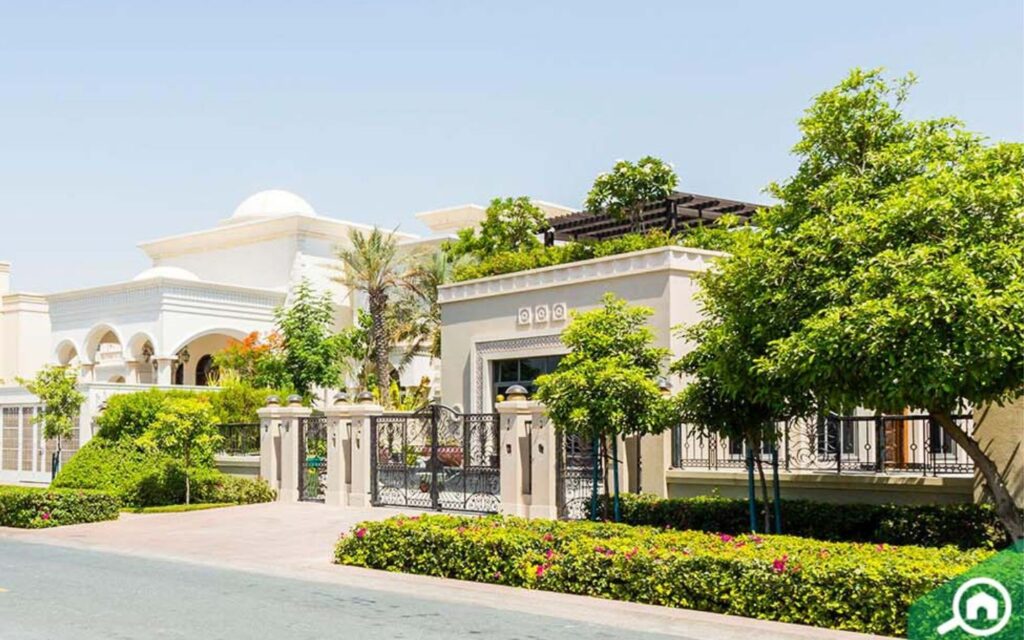 grand lakeside mansion streetscape in Emirates Hills Dubai