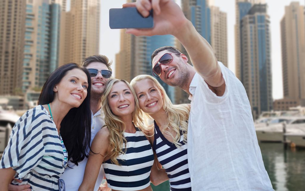 Tourists exploring downtown Dubai and waterfront promenades